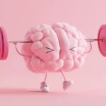 Pink cartoon brain character with arms and legs lifting a barbell, representing mental fitness and cognitive strength training