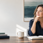 Woman reviewing notes at a desk, representing cognitive baseline assessment and planning